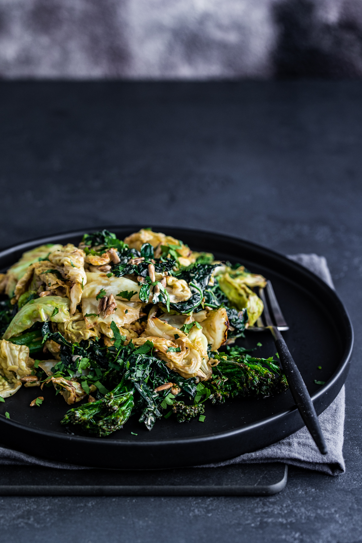 Broccoli rabe salad on a black plate