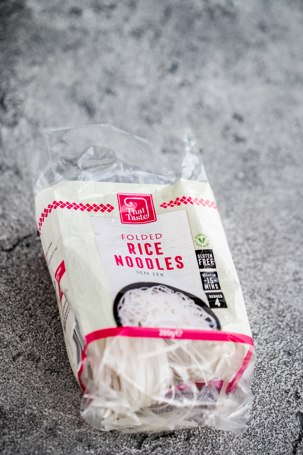 Pack of white rice noodles on a grey background