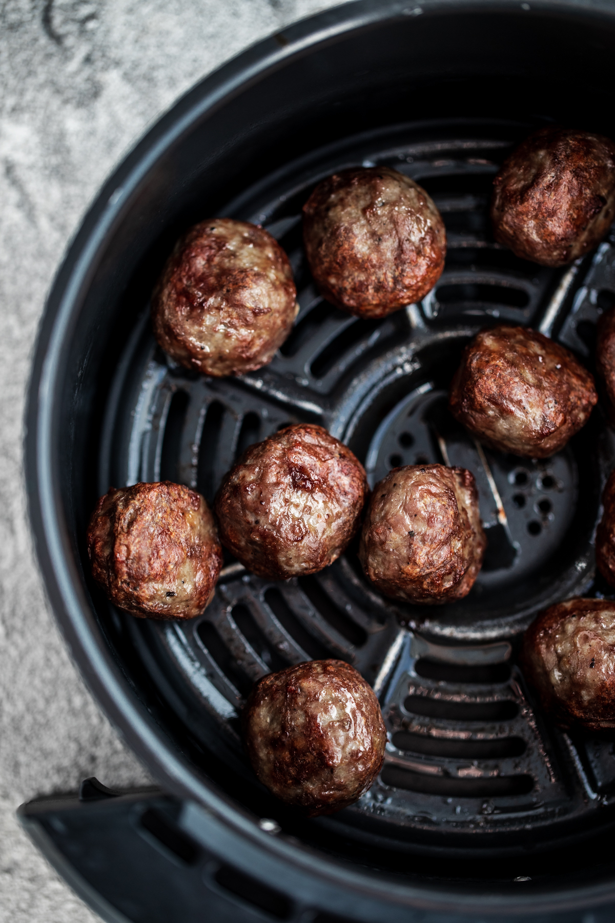 Overhead shot of meatballs cooked in an air fryer