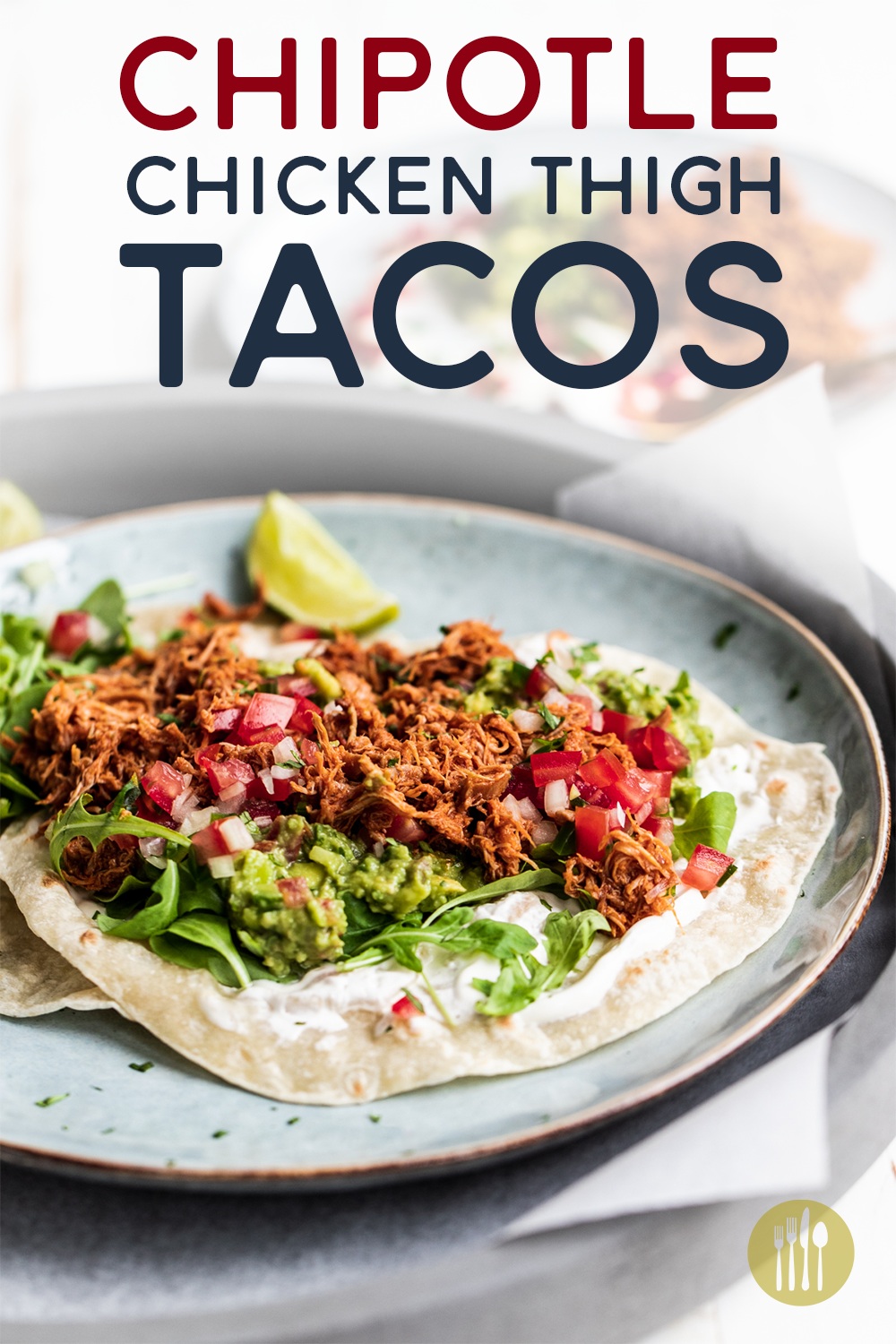 Slow cooked chipotle chicken tacos on a blue plate and white background with text