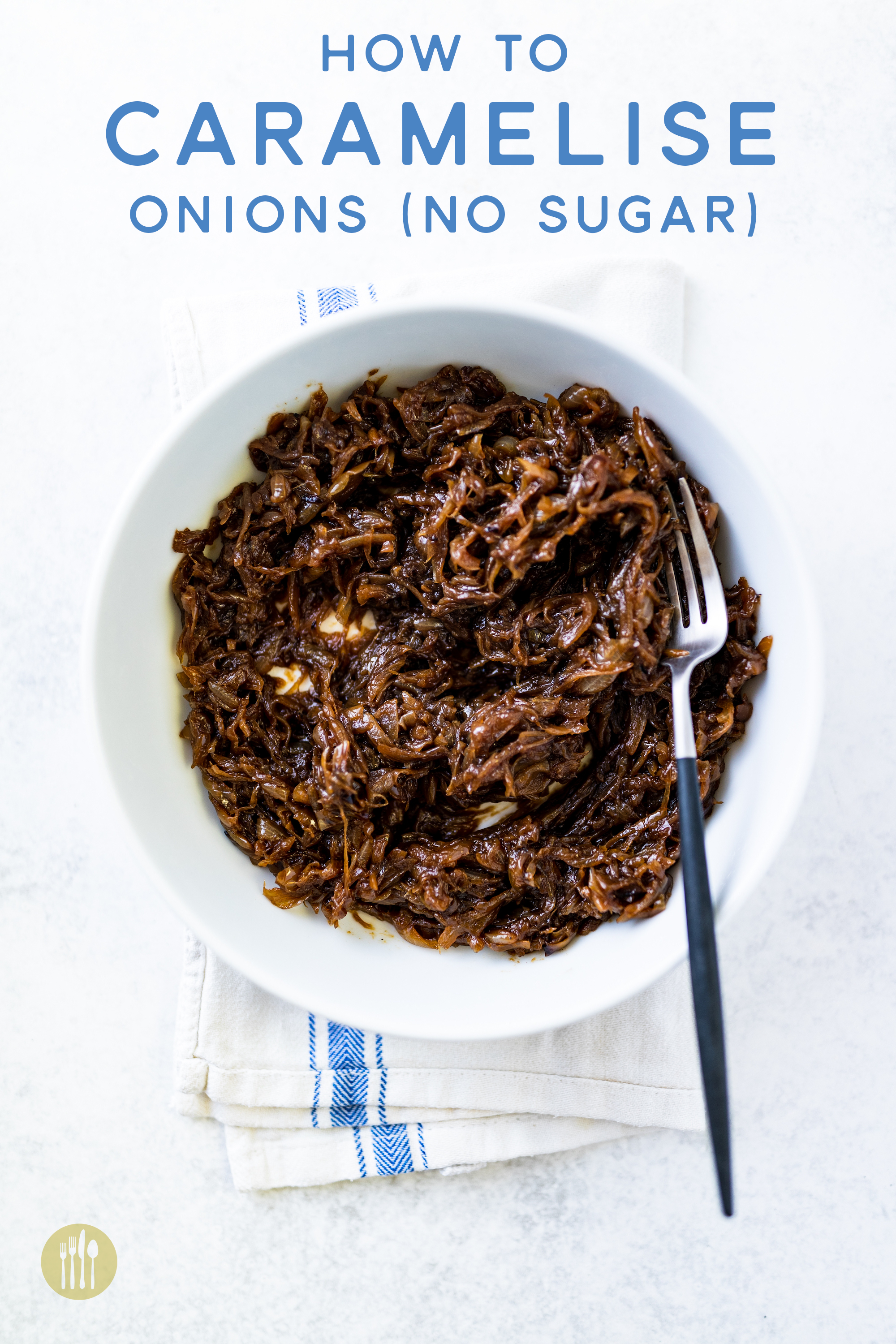 Caramelised onions in a white bowl on a tea towel and white background