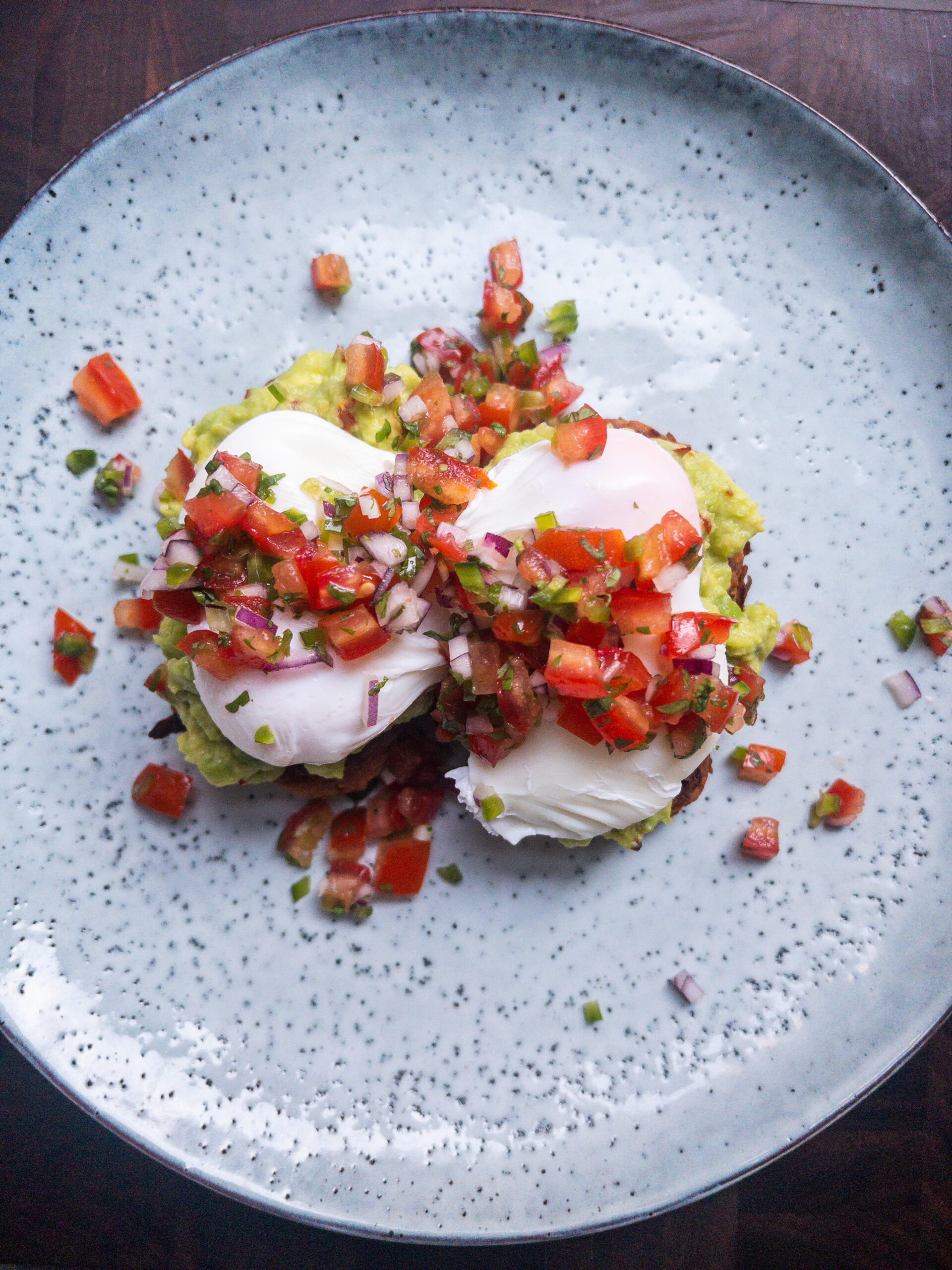 Overhead shot of sweet potato hash browns on a blue plate