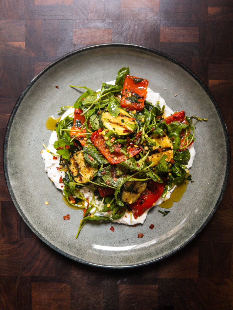 Grilled Courgette & Pepper with Burrata & Chimichurri on a grey plate