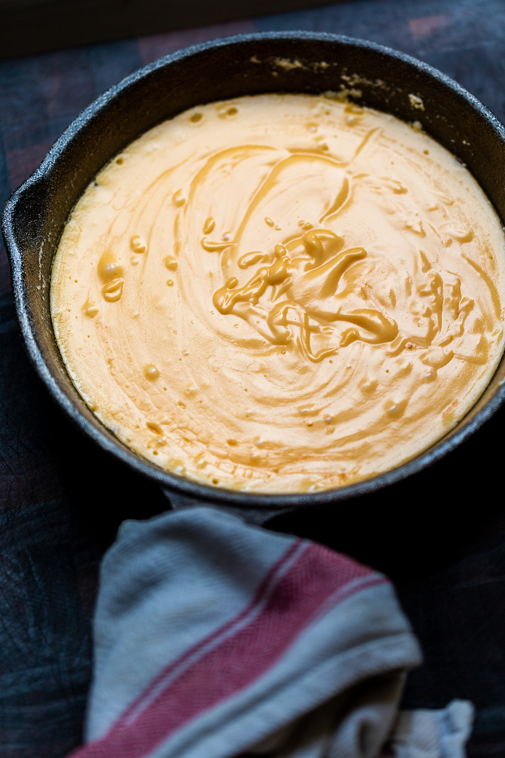 Freshly made hollandaise sauce in a cast iron pan