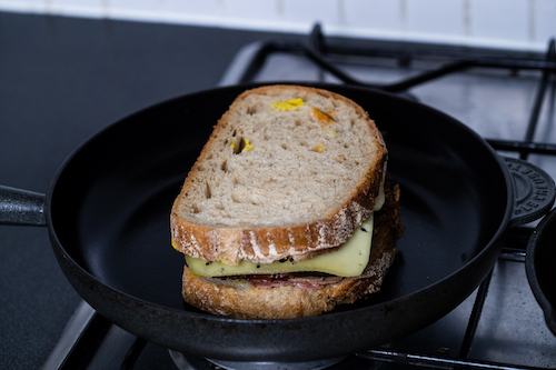 Cubano sandwich in a black cast iron pan