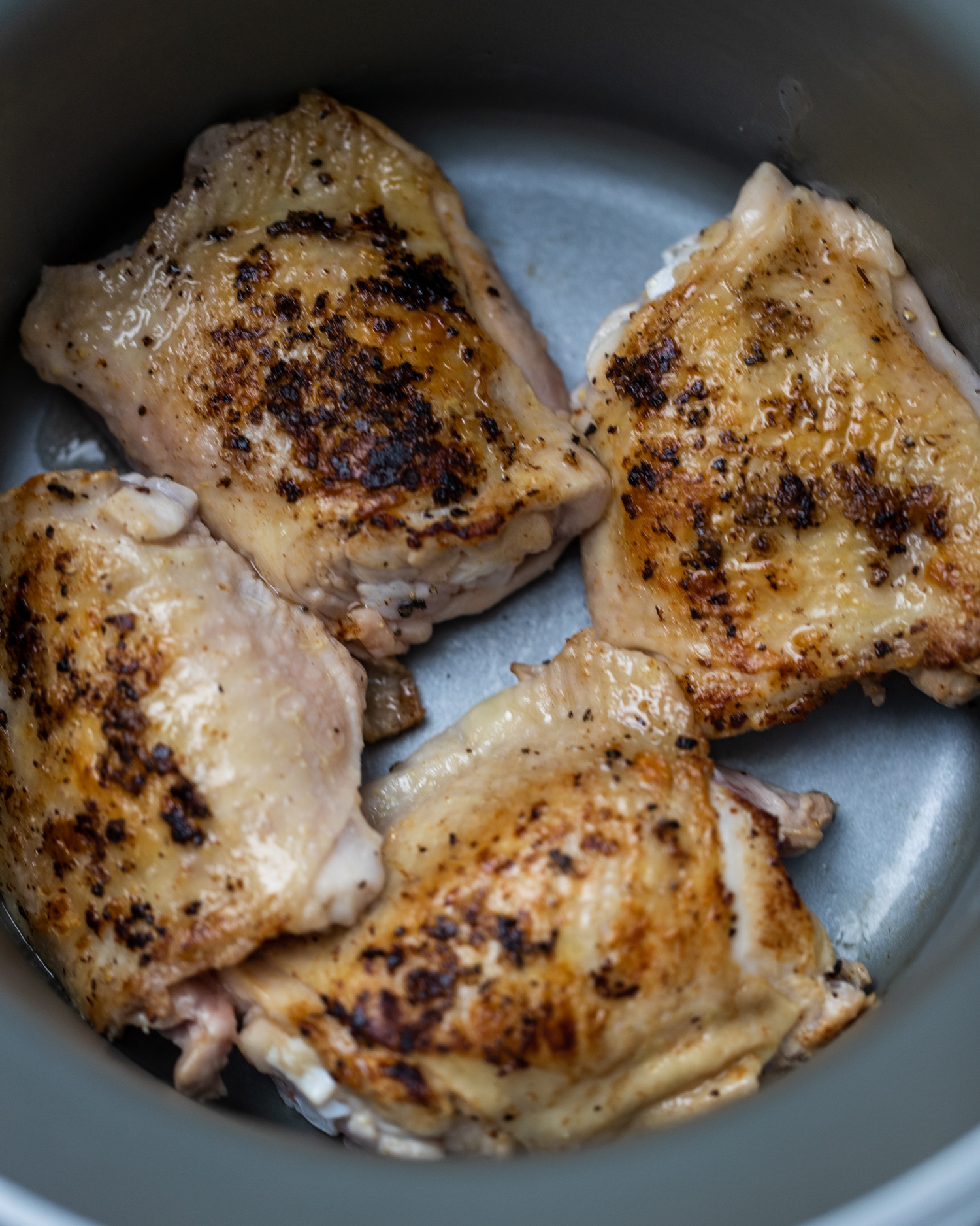 Seared skin on chicken thighs in a slow cooker