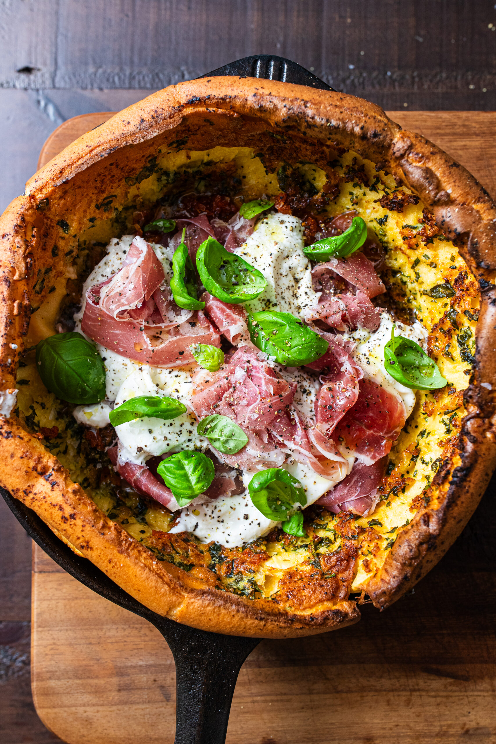 Overhead shot of burrata and Parma ham savoury dutch baby