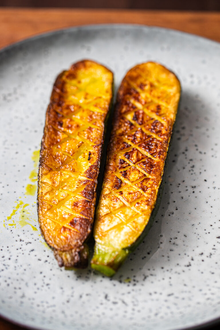 Viral Thomas Keller Zucchini on a blue plate before dressing is added