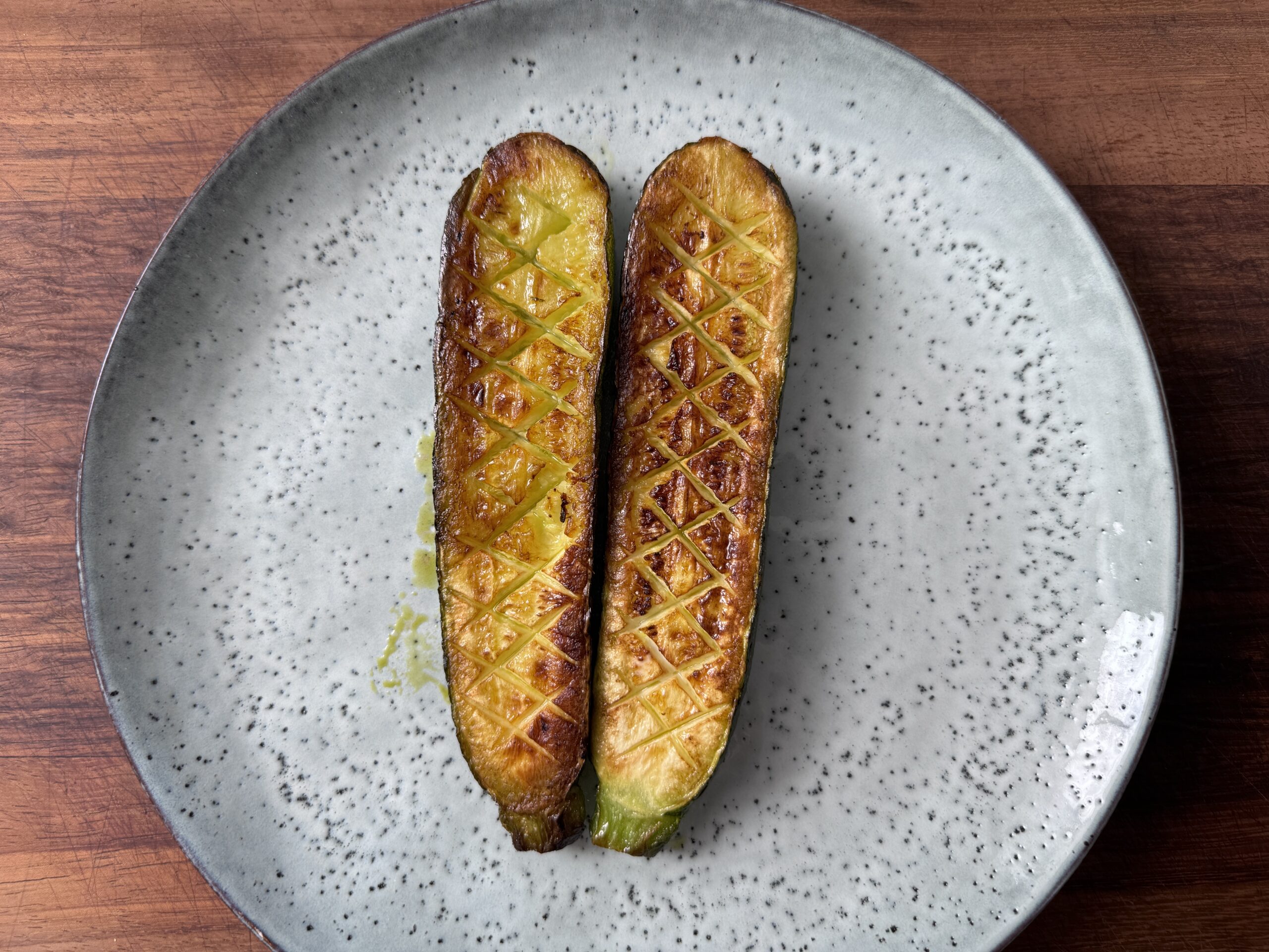 Viral Thomas Keller zucchini on a blue plate