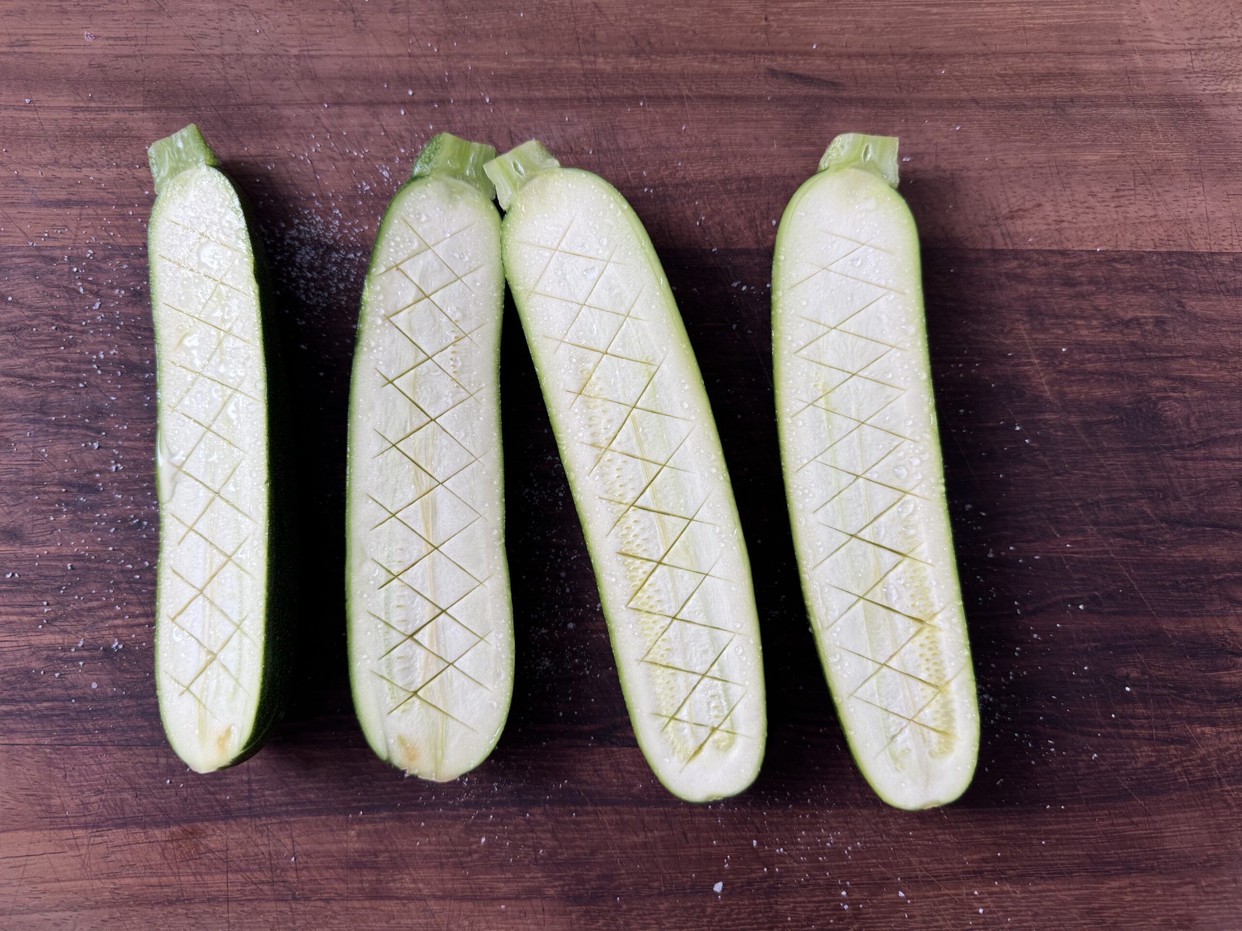 Zucchini cut in half lengthways and salted